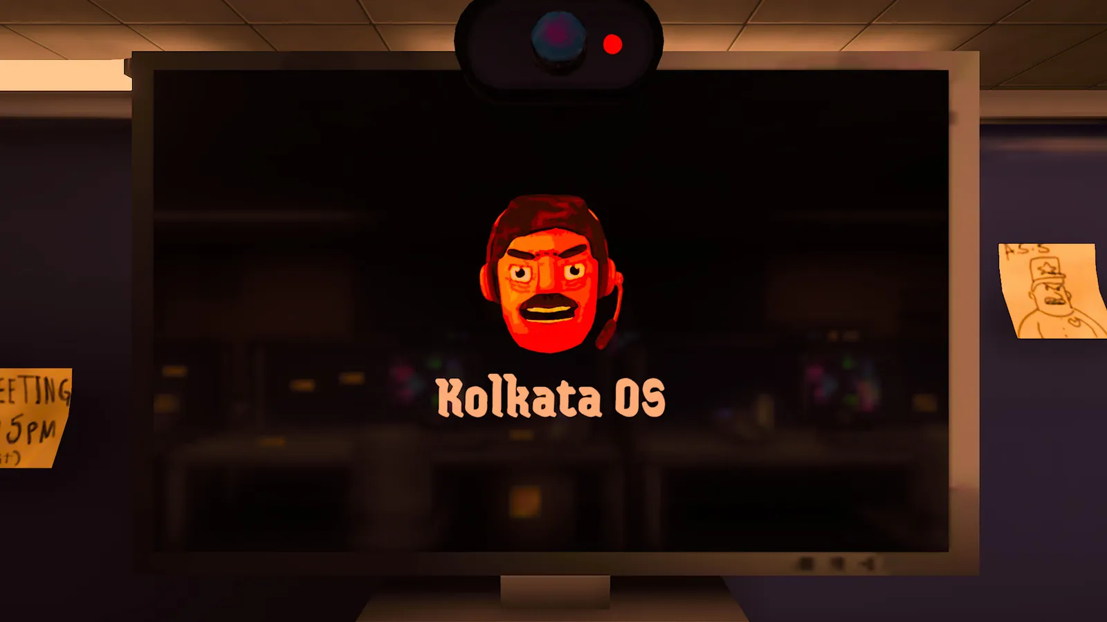 A monitor in a dark office showing the Kolkata OS boot screen with a cartoon face